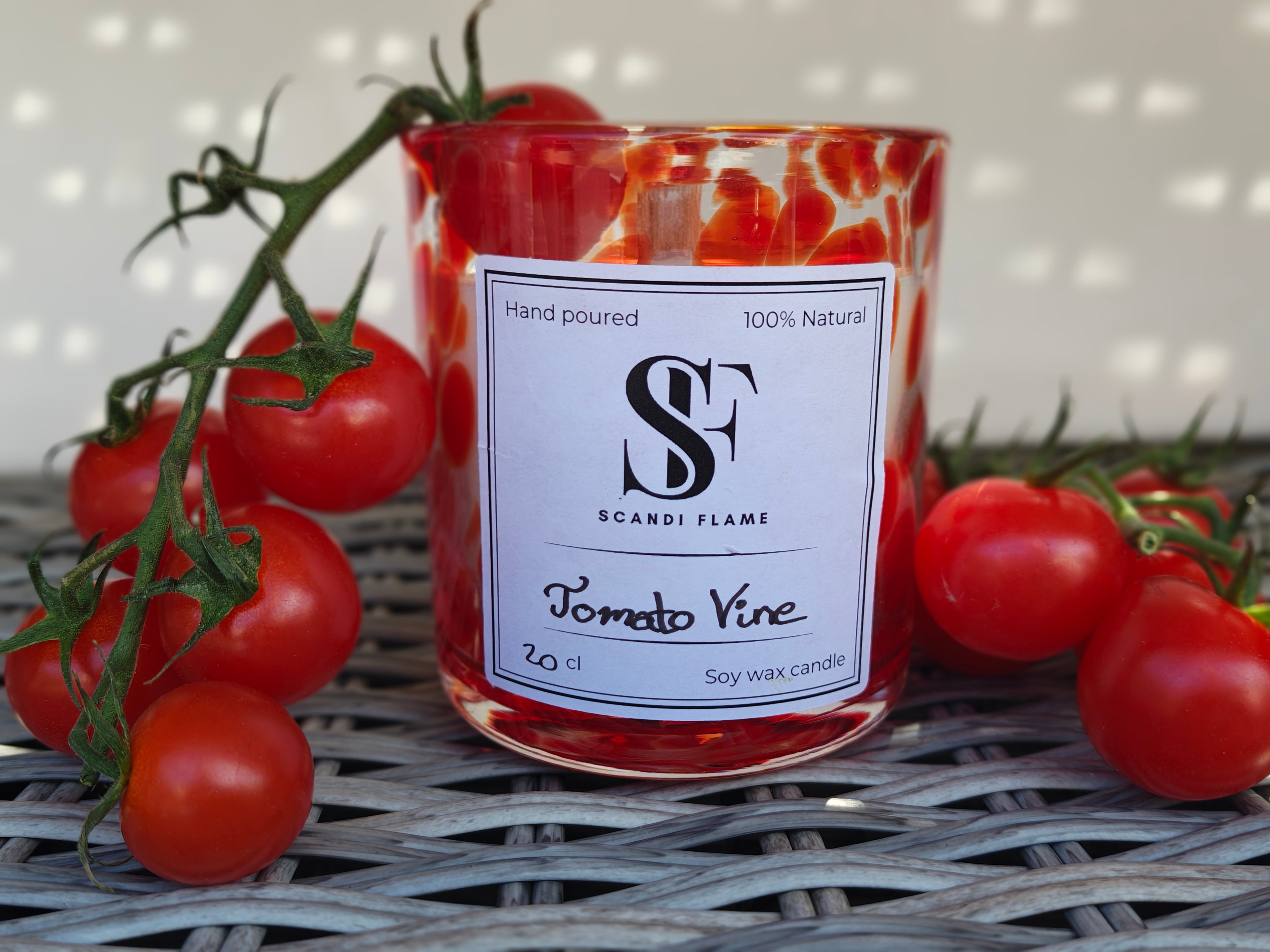 Red speckled Candle labelled 'Tomato Vine ' from Scandi Flame with tomatoes on a vine around it